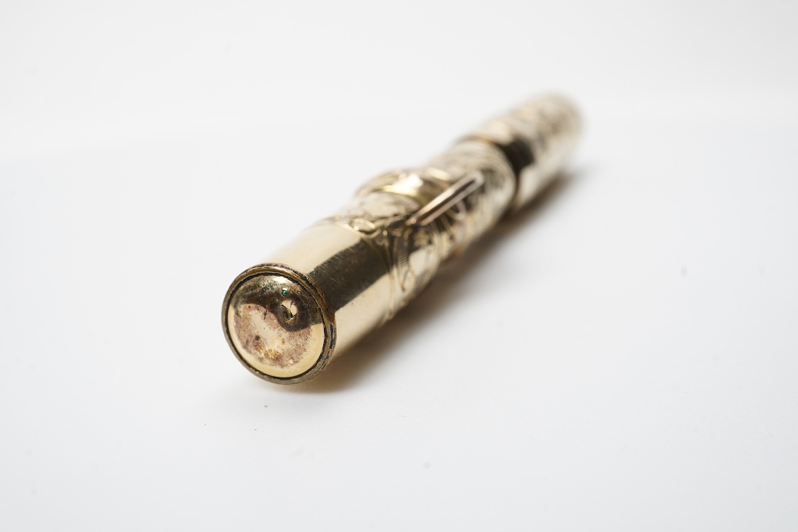 A Conklin ring top hand engraved crescent filler fountain pen with 14ct. gold Conklin flexible nib